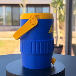 May include: A blue and yellow water cooler with a yellow handle and spout. The cooler has a cylindrical shape with a yellow lid and a blue body. The cooler has the number 4 printed on the side in yellow.