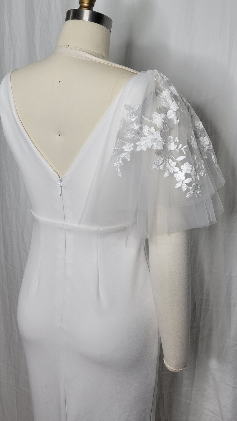 A pair of detachable, double layer puff sleeves, made of ultra soft tulle and floral lace.