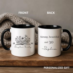 May include: White ceramic mug with a black handle and interior. The front features a floral design above the text "Chapter Thirty" and the numbers "19" and "96". The back reads "Strong, beautiful and 30 -Sophia".