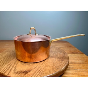Paul Revere 1801  2 quart copper saucepan featuring a brass handle and matching lid