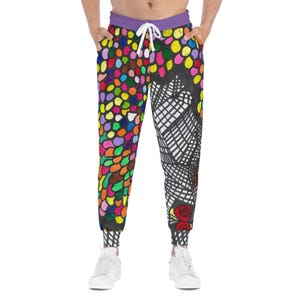 Pantalones deportivos con estampado gráfico vibrante: pantalones deportivos creativos y de estilo deportivo