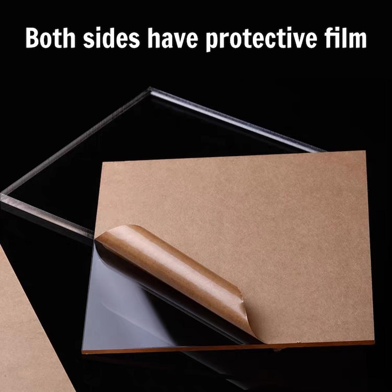 May include: Clear acrylic sheet with protective film being peeled back, revealing the transparent surface. The text "Both sides have protective film" is displayed at the top. The sheet is against a black background.