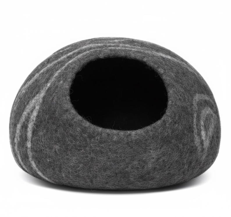 May include: A gray felt pet cave with a round opening. The cave has a rounded shape with a swirl pattern in a lighter shade of gray. The interior is dark. This pet bed is designed for small animals.