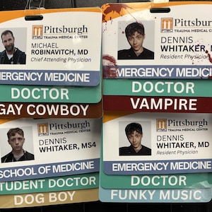May include: Several name badges from the Pittsburgh Trauma Medical Center are displayed. Each badge includes a photo, name, and title, such as "Chief Attending Physician" and "Resident Physician." Additional text includes "Emergency Medicine," "Doctor," and humorous phrases.