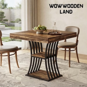 May include: A square wooden dining table with a dark brown wood grain finish and a black metal base featuring curved vertical supports and two lower shelves. The text WOWWOODEN LAND is visible in the upper right corner above the table.
