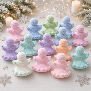 May include: A collection of small, crocheted angel figurines in various pastel colors including pink, blue, green, purple, orange, and white. Each figure features a rounded head, outstretched arms, and a flared base adorned with matching beads.