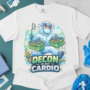 May include: White t-shirt featuring a cartoon illustration of a person in a hazmat suit, carrying trays of medical instruments. The text "DECON IS MY CARDIO" is displayed below the image.