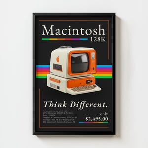 May include: A framed poster featuring a vintage Macintosh 128K computer. The computer is white and orange with a keyboard. The poster has the text "Macintosh 128K" and "Think Different" on a black background, with a rainbow stripe.