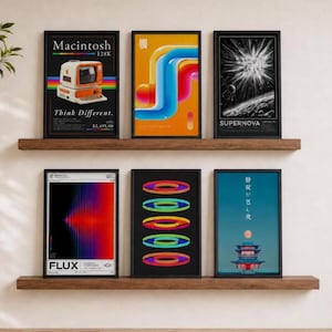 May include: Six framed rectangular posters arranged on two wooden shelves. The prints feature diverse graphic designs including a vintage computer, abstract colorful tubes, a supernova, a light flux pattern, concentric rings, and a Japanese pagoda.