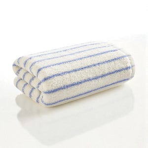 May include: Folded white towel with blue horizontal stripes. The towel is made of a soft, absorbent material and is folded neatly. The stripes are evenly spaced across the width of the towel.