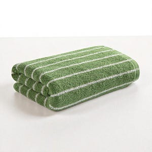 May include: Folded green towel with white horizontal stripes. The towel is made of a soft, absorbent material, perfect for use in a bathroom or spa. The simple design and color scheme make it a versatile addition to any home.