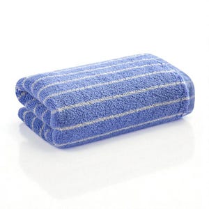 May include: Folded blue bath towel with white stripes. The towel is made of a soft, absorbent material and is folded neatly. The stripes run horizontally across the towel.