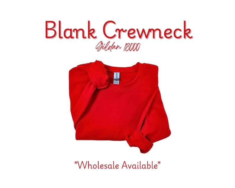 May include: A bright red crewneck sweatshirt, folded neatly on a white background. The text "Blank Crewneck" is displayed in red, with "Gildan 18000" below it. The words "Wholesale Available" are at the bottom.