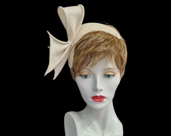 Ivory headband, bandeau, fascinator, large bow detail, cocktail hat, asymmetrical design, one size, elastic fixing, made in UK