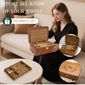 May include: A wooden jewelry box with multiple compartments and a soft, beige interior. The box is open, revealing various jewelry pieces. Text on the image reads: "STORE ALL KINDS OF YOUR JEWELS" and "THE PERFECT GIFT".