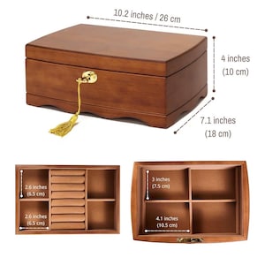 May include: A wooden jewelry box with a curved top, measuring 10.2 inches long, 4 inches high, and 7.1 inches deep. It features a gold-colored lock and a decorative tassel. The interior includes compartments and ring slots.