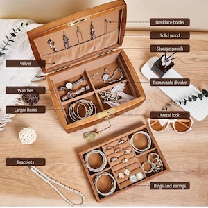 May include: A wooden jewelry box with multiple compartments, including necklace hooks, watch storage, and ring slots. The interior is lined with velvet. The box is open, displaying various jewelry items like bracelets and earrings.