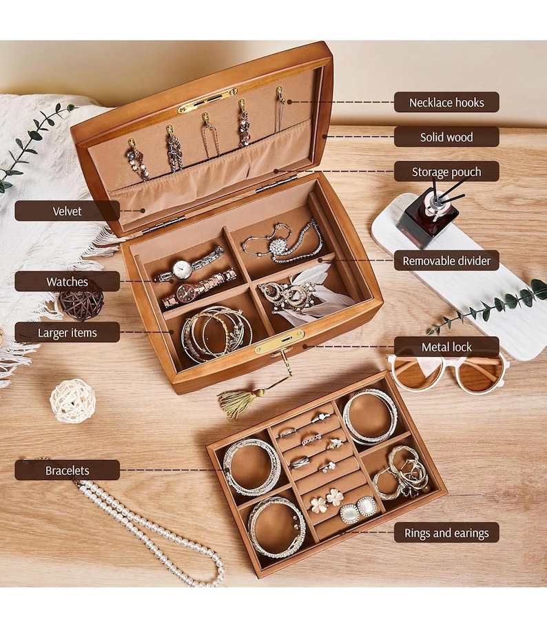 May include: A wooden jewelry box with multiple compartments, including necklace hooks, watch storage, and ring slots. The interior is lined with velvet. The box is open, displaying various jewelry items like bracelets and earrings.