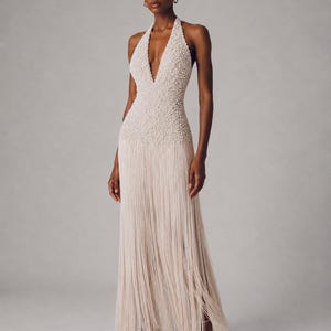 beaded reception dress for bride TO HAVE ANS TO HOLD. Fully hand beaded reception dress for praise .. Bride @praise.uzosike Wedding dress @homahandss Content creator: @chamach_ Planner: @theventbutterfly Bride: @praise.uzosike Hairstylist: @omiibyomii Photographer: @wugado