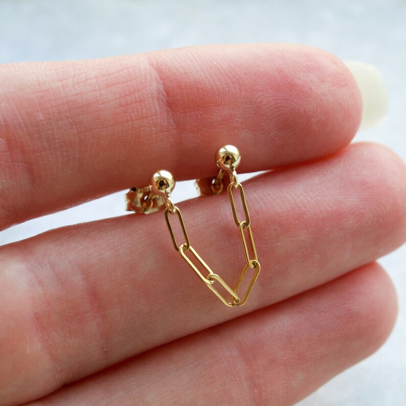 Two stud earrings connected by chain Clearance