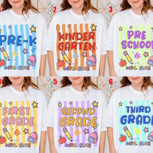 May include: White t-shirts with grade level designs. Each shirt features a grade level name, a pencil, an apple, a backpack, and the name "MRS. ALICE". The grade levels include Pre-K, Kindergarten, Pre-School, First Grade, Second Grade, and Third Grade.