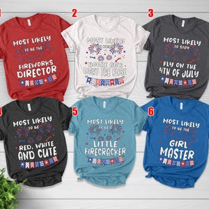 May include: A collection of six short-sleeved t-shirts in various colors, each with a patriotic theme. The shirts feature phrases like "Fireworks Director," "Fly on the 4th of July," and "Little Firecracker," with red, white, and blue graphics.