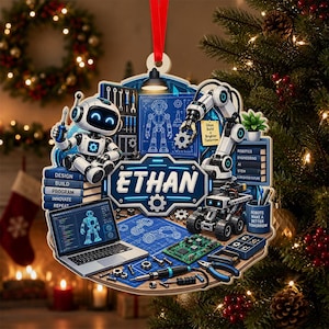 May include: A wooden Christmas ornament featuring a robot theme with the name ETHAN in the center. The design includes a laptop, a robotic arm, tools, and blueprints. Text on the ornament reads: Design, Build, Program, Innovate, Repeat, Ideas Build a Brighter Tomorrow, Robotics, Engineering, AI, STEM, A Brighter Future, and Robots Make a Brighter Tomorrow.