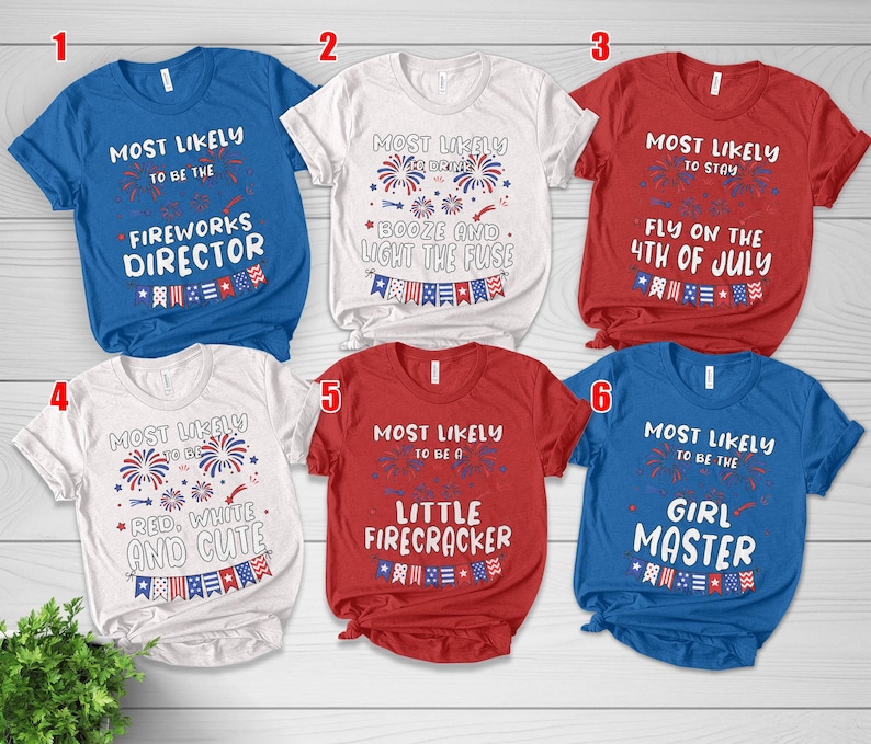 May include: A collection of six short-sleeved t-shirts in various colors, including blue, white, and red. Each shirt features a unique graphic design with text related to the 4th of July, such as "Fireworks Director" and "Little Firecracker."