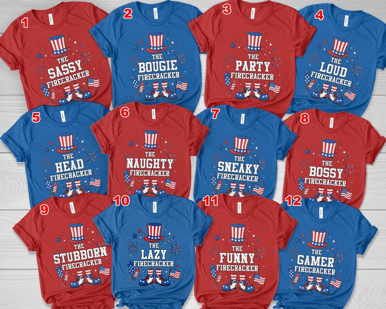 May include: A selection of red and blue t-shirts with patriotic designs. Each shirt features an Uncle Sam hat graphic and a phrase such as "The Sassy Firecracker", "The Bougie Firecracker", or "The Party Firecracker", with American flag accents.