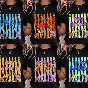May include: Black t-shirts with colorful school-themed designs. Each shirt features a grade level: Pre-K, Kindergarten, Preschool, First Grade, Second Grade, and Third Grade. Designs include pencils, apples, backpacks, and the text "MRS. ALICE".