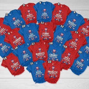 May include: A selection of red and blue t-shirts, each emblazoned with the words "The Firecracker" and a descriptive adjective. The shirts feature a firework graphic and phrases such as "Party," "Lazy," and "Sneaky."