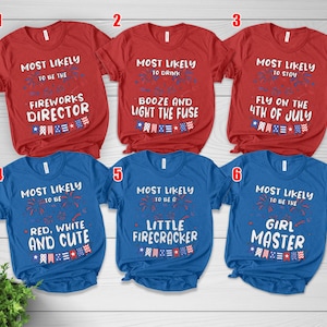 May include: Red and blue t-shirts with white text and patriotic graphics. The shirts have phrases like "Most Likely to be the Fireworks Director" and "Most Likely to be Red, White, and Cute."