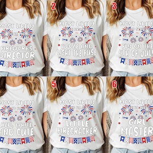 May include: White t-shirts with various patriotic phrases and graphics. Designs include fireworks, stars, and text like "Fireworks Director," "Red, White, and Cute," and "Fly on the 4th of July." Each shirt has a red, white, and blue banner.