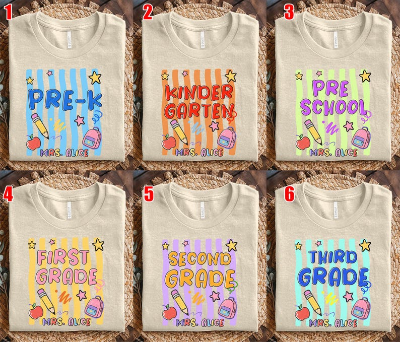 May include: Beige t-shirts with colorful school-themed designs. Each shirt features a grade level: Pre-K, Kindergarten, Preschool, First Grade, Second Grade, and Third Grade. Designs include pencils, apples, backpacks, and stars.