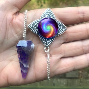 ametheyst crystal pendalum with attached chakra swirl pendant