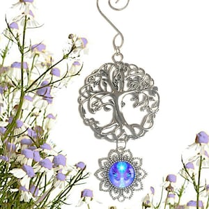 small pewter tree of life with a spiral hanger and a dangling purple angel art pendant underneath in a flower shaped pendant setting