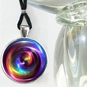 colorful round necklace featuring rainbow swirl chakra art sealed under glass