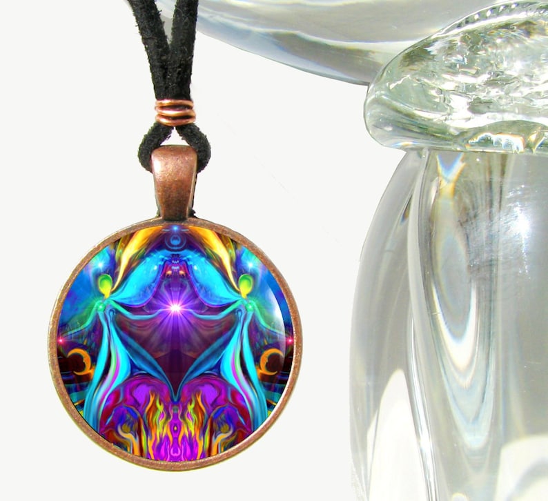 round twin flames necklace featuring  a psychedelic art print of two angels hand in hand sitting on a violet flame heart