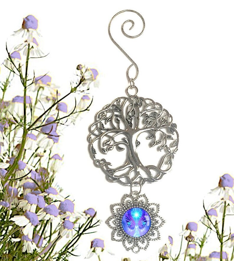 small pewter tree of life with a spiral hanger and a dangling purple angel art pendant underneath in a flower shaped pendant setting