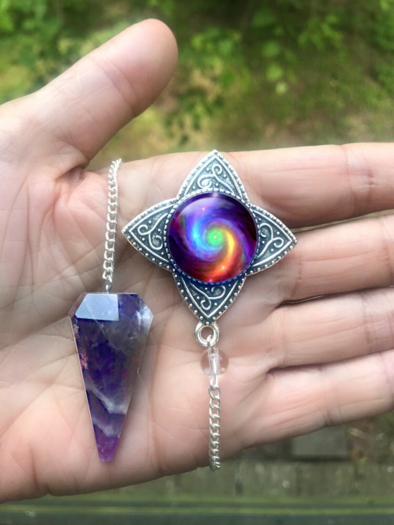 ametheyst crystal pendalum with attached chakra swirl pendant