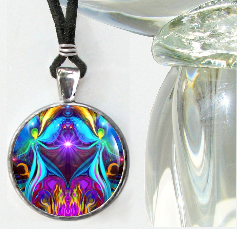 round twin flames necklace featuring  a psychedelic art print of two angels hand in hand sitting on a violet flame heart