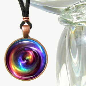 colorful round necklace featuring rainbow swirl chakra art sealed under glass