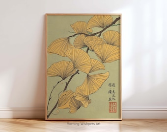May include: A framed art print featuring a botanical illustration of ginkgo leaves. The artwork showcases fan-shaped yellow leaves on dark brown branches against a muted green background. The print includes Japanese text and a red seal.