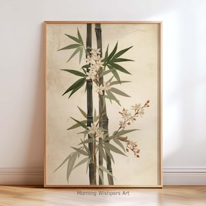 May include: Framed botanical print featuring bamboo stalks with green leaves and delicate white flowers. The artwork has a vintage aesthetic with a neutral background and a wooden frame. The text "Morning Wishpers Art" is at the bottom.