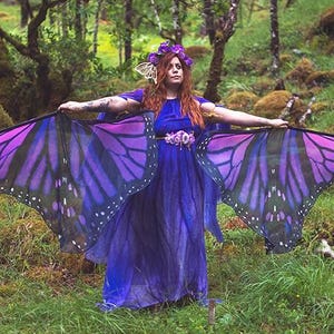 Ali di farfalla monarca: bandiere viola, accessorio per le prestazioni