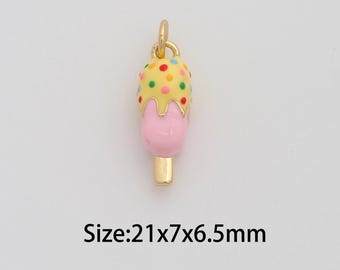 May include: A gold-colored ice cream charm with a pink ice cream cone and yellow ice cream with colorful sprinkles. The charm measures approximately 0.83 x 0.28 x 0.26 inches. The charm has a small loop at the top for attaching to a necklace or bracelet.