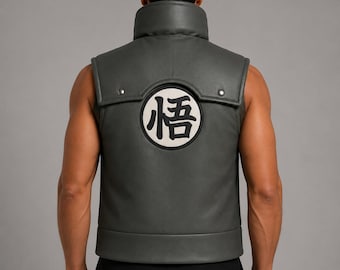 May include: A dark gray sleeveless vest featuring a high collar and a circular patch on the back. The patch contains a white background with a black Japanese kanji character. The vest has a smooth finish with visible silver-toned metal studs.