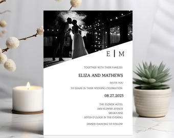 May include: A black and white wedding invitation with a photo of a couple kissing. The invitation includes the names "Eliza and Mathews", the date "08.27.2025", and venue details. The invitation is on a white background.