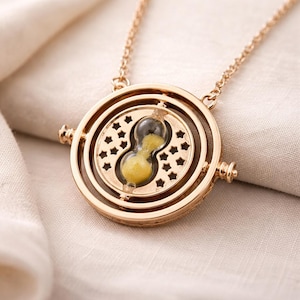 May include: A set of three ceramic mugs with a speckled, matte finish. The mugs are in shades of cream, light gray, and dark gray. Each mug has a simple, minimalist design, perfect for coffee or tea.