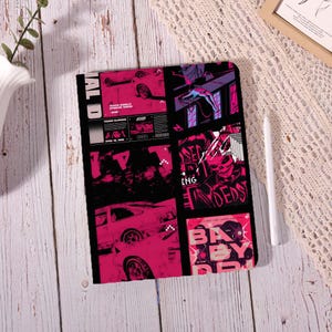 May include: Black tablet case with a vibrant, pink and black graphic design. The design features racing cars, a skull, and text elements. The case has a sleek, modern aesthetic.
